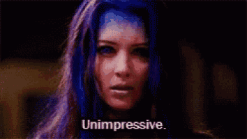 a woman with blue hair is saying unimpressive
