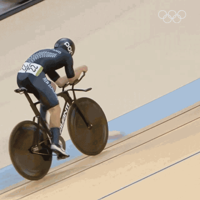 a person riding a bicycle with the number 22 on their back