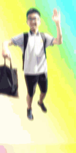 a boy with glasses and a backpack is holding a black bag
