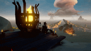 a man sits in front of a torch on a wooden deck overlooking the ocean