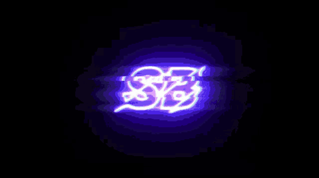 a purple light is projected on a black background and says sb .