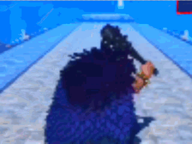 a blurry picture of a person in a video game with a blue background .