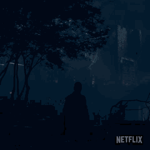 a netflix advertisement shows a man walking through a dark forest