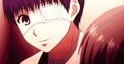 a young boy with a bandage on his eye is smiling .