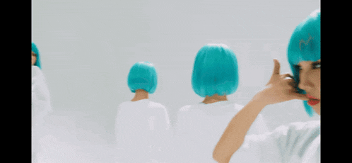 a woman with blue hair is making a call me sign