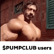 a man with very large muscles is standing in front of a brick wall with shutters .