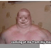 a shirtless man is standing in front of a wall and looking at the camera .