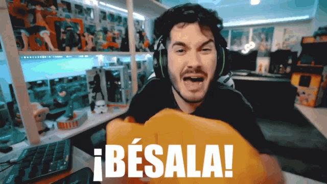 a man wearing headphones with the word besala on the bottom right