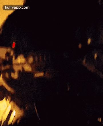 a man with a beard is wearing a helmet and goggles while holding a gun .