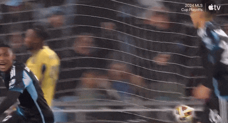 a blurry picture of a soccer game with the words 2024 mls cup playoffs at the top
