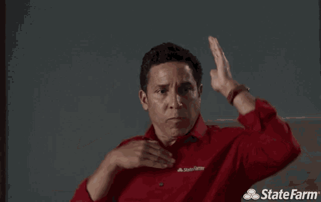 a man wearing a red shirt with state farm written on it