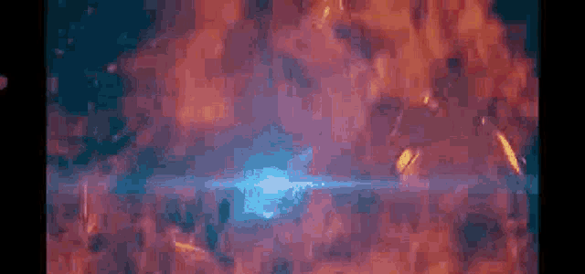 a close up of a blue light coming out of a fireball .