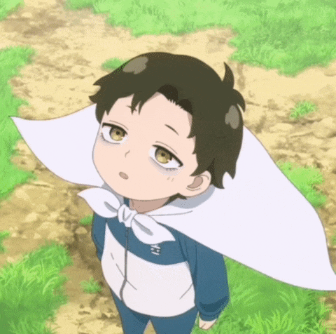 a young boy with a white scarf around his head