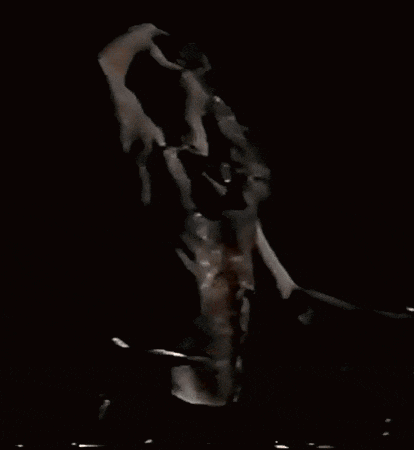 a man without a shirt is playing a drum set