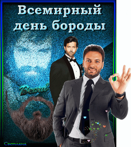 a man in a suit and tie with a beard giving an ok sign