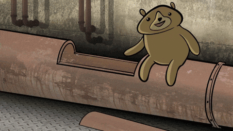 a teddy bear is sitting on a rusty pipe