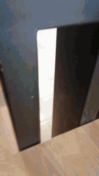 a black door with a white stripe on the bottom