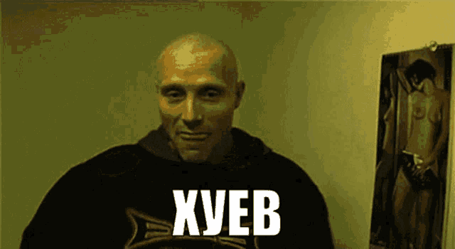 a man wearing a black shirt that says xueb