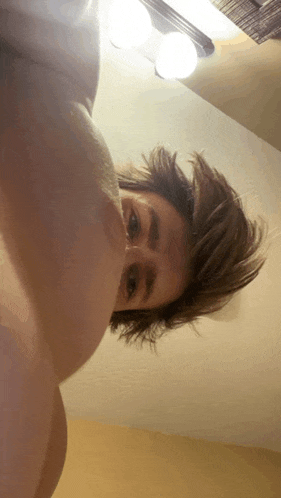 a close up of a person 's face with a light on