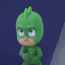 a cartoon character is wearing a green costume with a skull on the chest