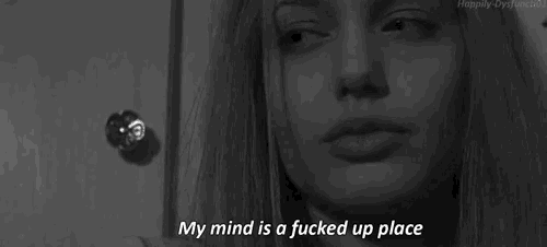 a black and white photo of a woman with the words " my mind is a fucked up place " written below her