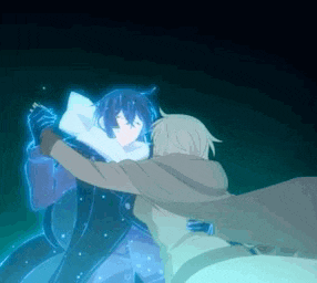 a man and a woman are hugging each other in a dark room .