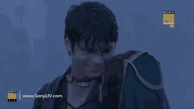 a sony tv ad with a man and woman kissing in the rain