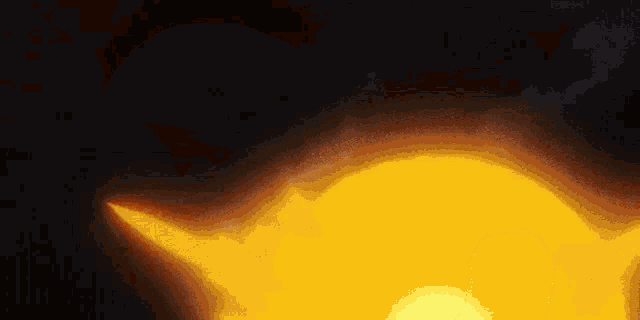 a computer generated image of a yellow object in the dark