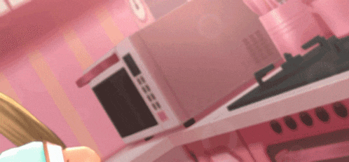 a pink microwave is sitting on a pink counter top