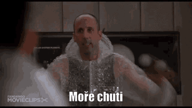 a man is covered in plastic bubble wrap and says more chuti