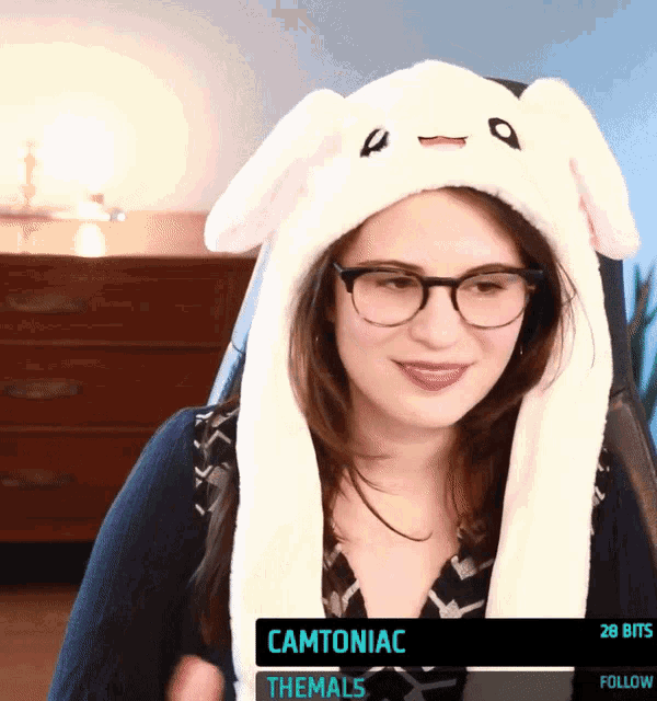 a woman wearing glasses and a bunny hat says camtoniac on the screen