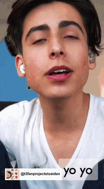a close up of a young man 's face with the words yo yo below him