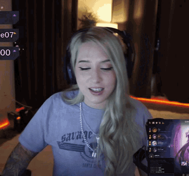 a woman wearing a purple shirt that says savage