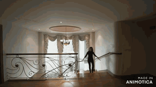 a woman is walking down a set of stairs made in animonica