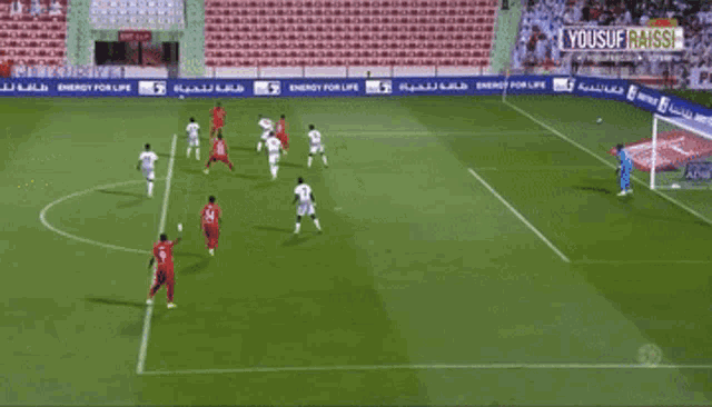 a soccer game is being played in a stadium sponsored by pride of abudhab