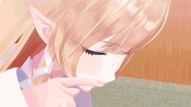 a girl with blonde hair and blue eyes is being licked by someone