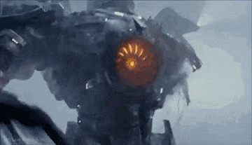 a close up of a robot with a red light coming out of its head .