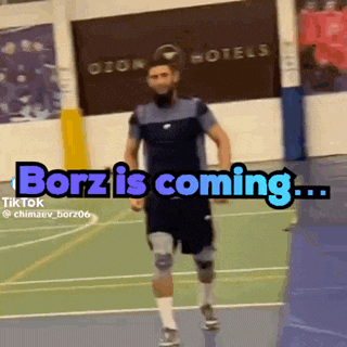 a man is running on a court with the words ' borz is coming ' written on it