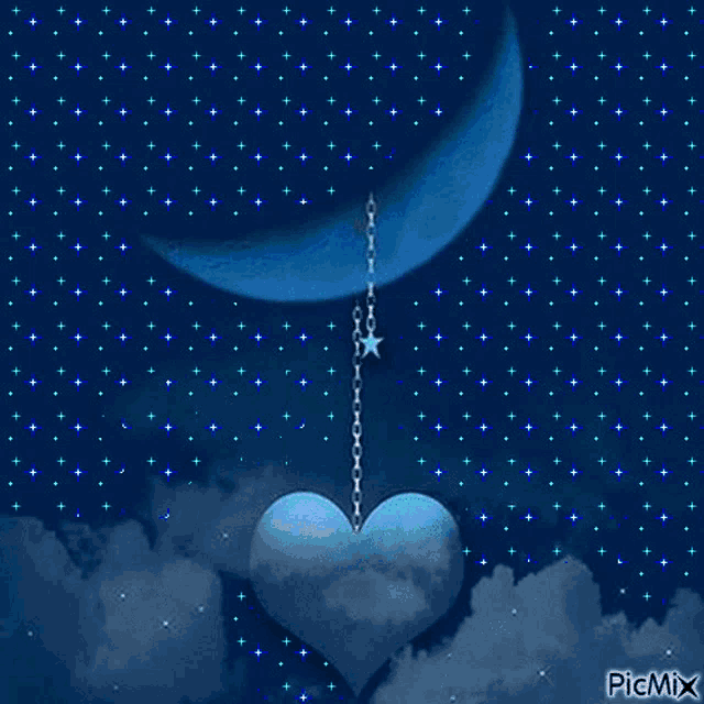 a blue heart hanging from a chain with a crescent moon in the background