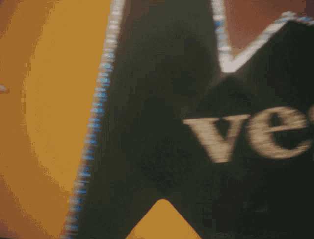 a blurred image of a blue sign that says mex