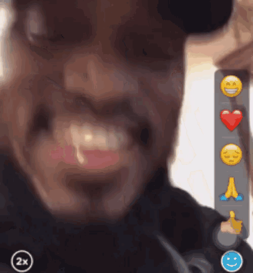 a close up of a person 's face with emojis on the bottom of the screen