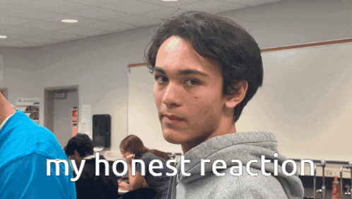 a young man in a classroom with the words my honest reaction