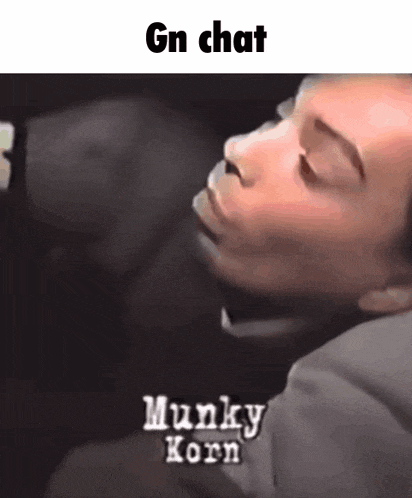 a man is sleeping in a car with the words gn chat munky korn written on the bottom of the image .