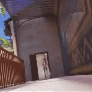 a cartoon girl is riding a bike down a hallway .