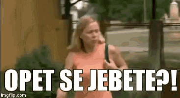 a woman in an orange dress is running down a street with the words opet se jebete ?