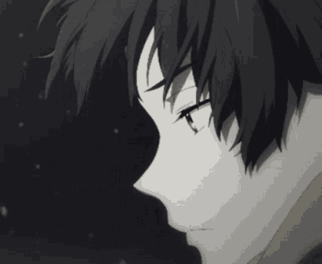 a close up of a person 's face in a dark room
