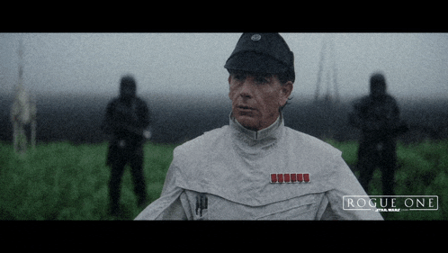 a poster for rogue one star wars shows a man in a white jacket