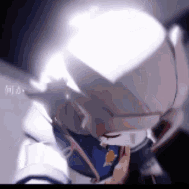 a close up of a person 's face with a glowing light coming out of it