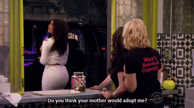 a woman wearing a black shirt that says max 's homemade cupcake