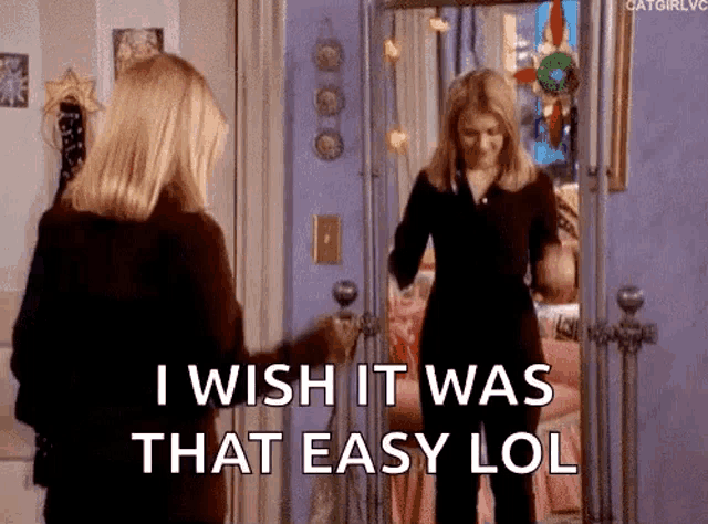 a woman is standing in front of a mirror with the words `` i wish it was that easy lol '' written on it .